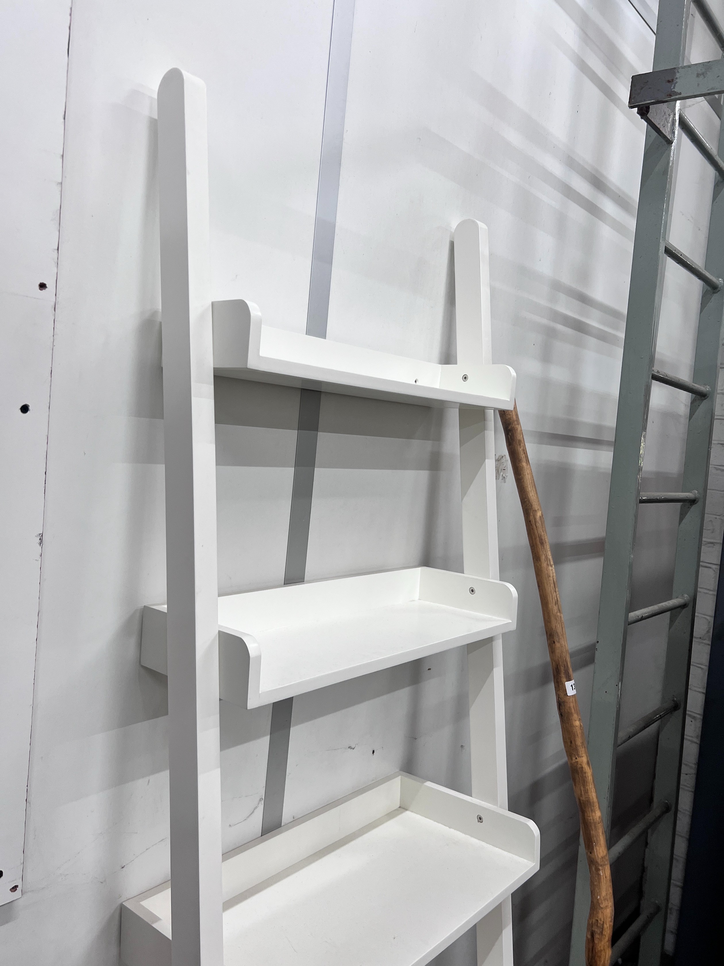 A contemporary graduated shelving unit, height 190cm *Please note the sale commences at 9am.